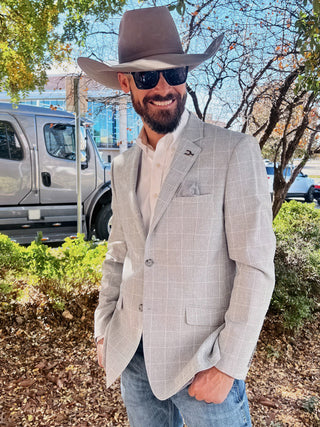 Man wearing a tailored cowboy sport coat from Espuela Design Co showcasing modern western style for weddings, rodeos, and everyday wear