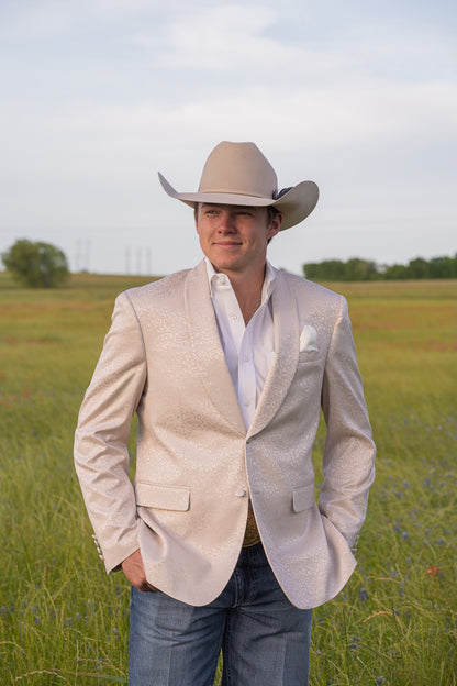 Close-up of pocket square on cream paisley cowboy sport coat for cowboy groom attire